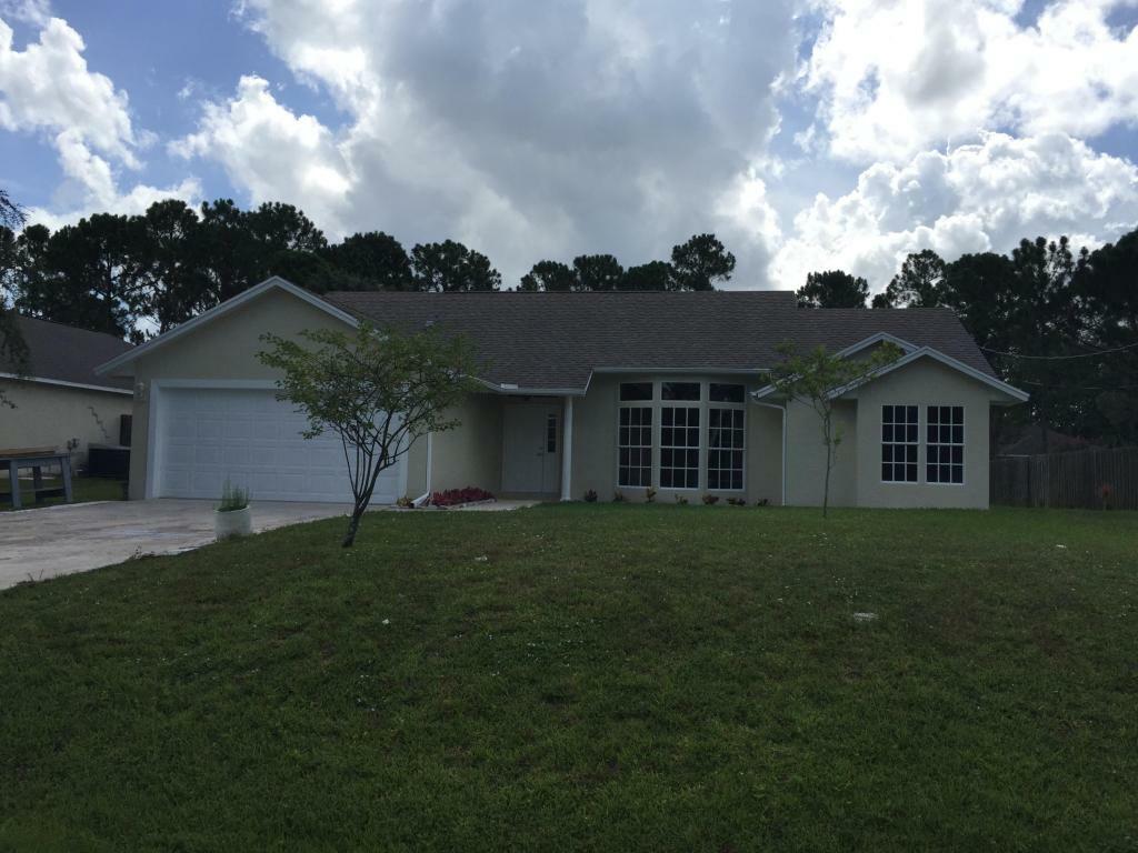 Property Photo:  4033 SW Kamsler Street  FL 34953 