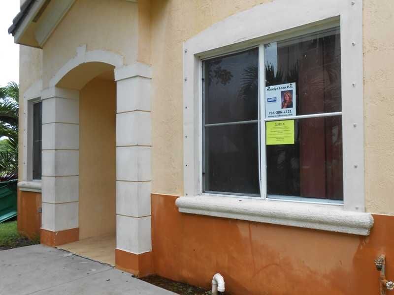 Property Photo:  7305 NW 174 Te 100  FL 33015 