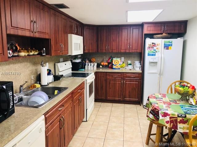 Property Photo:  7000 NW 186th St 4-123  FL 33015 