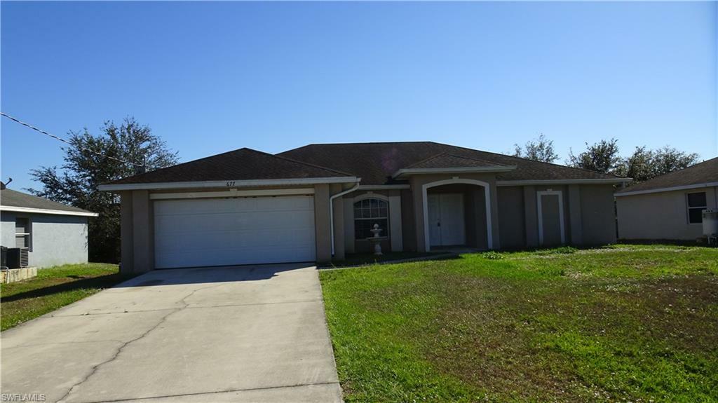 Property Photo:  677 Woodcrest Drive  FL 33972 