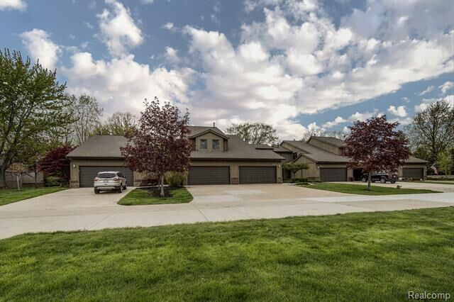 Property Photo:  9989 Hawthorne Glen Drive 132  MI 48138 