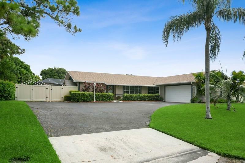 Property Photo:  4169 Larch Avenue  FL 33418 