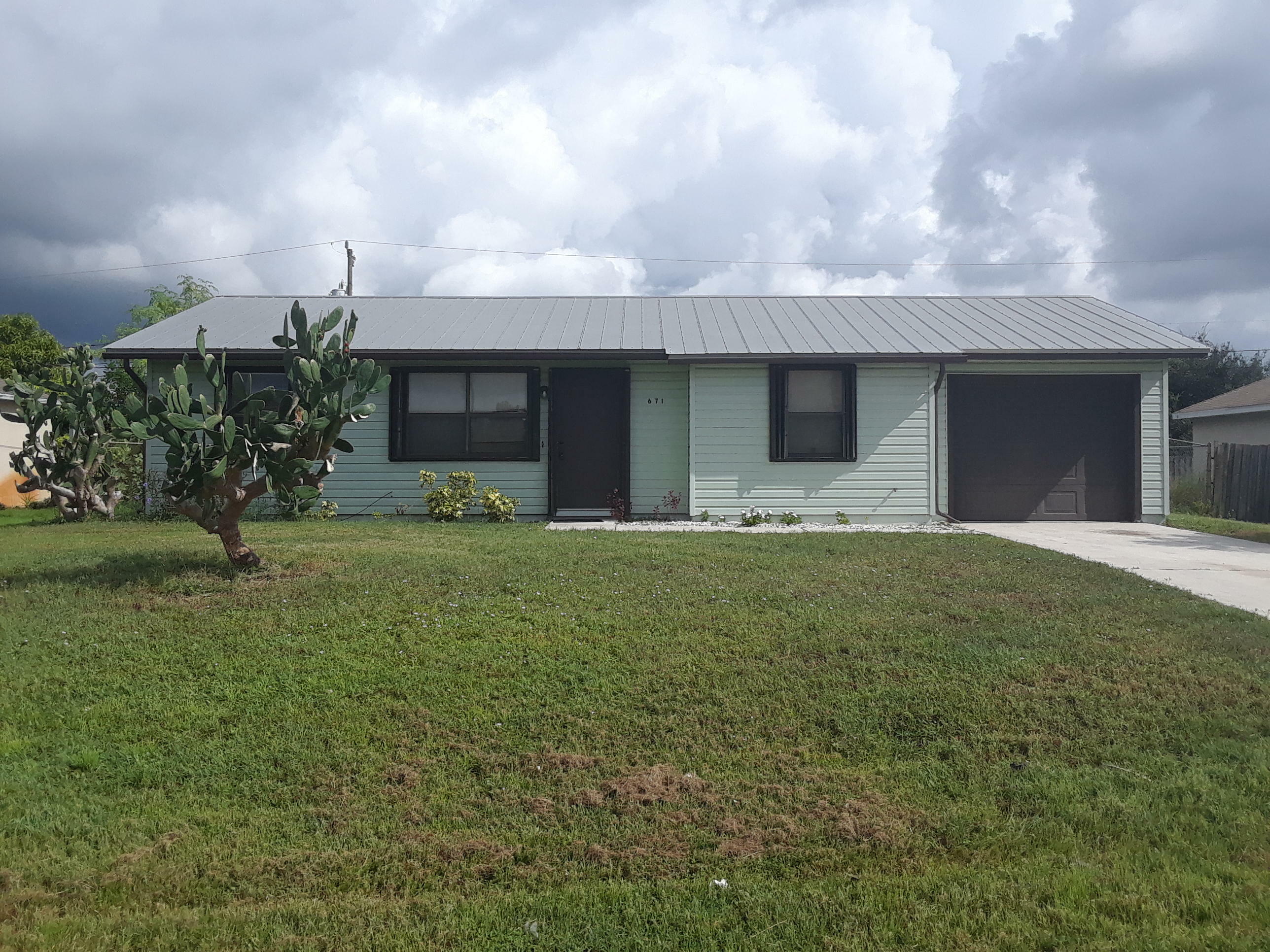 Property Photo:  671 SW Sardinia Avenue  FL 34953 