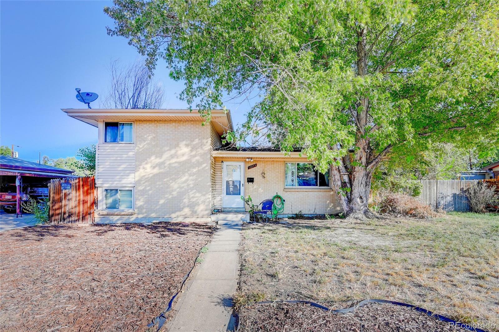 Property Photo: 13873 E 23rd Avenue CO 80011