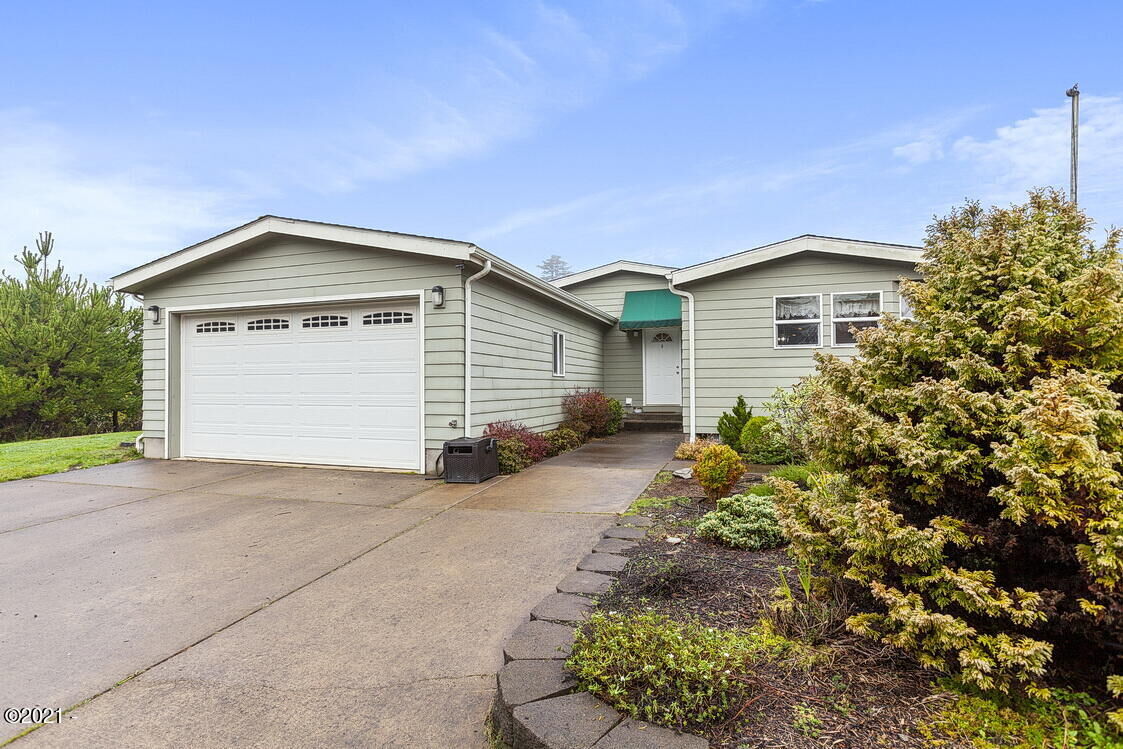 Property Photo:  8715 NW Seal Rock Street  OR 97376 