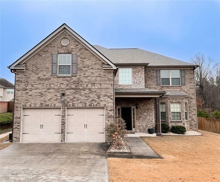 Property Photo: 214 Saintvry Path GA 30349