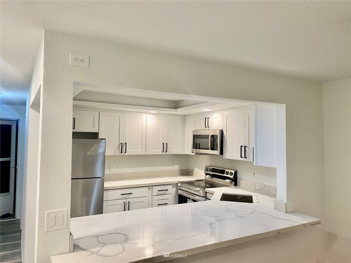 Property Photo:  2613 NE 4th Street 221  WA 98056 