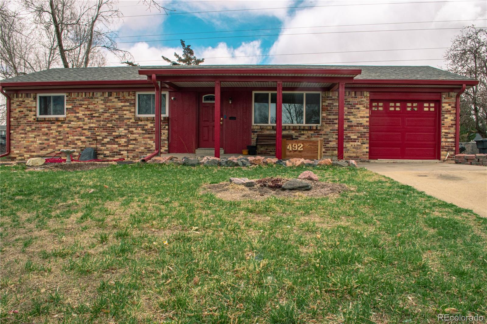 Property Photo:  492 Zion Street  CO 80011 