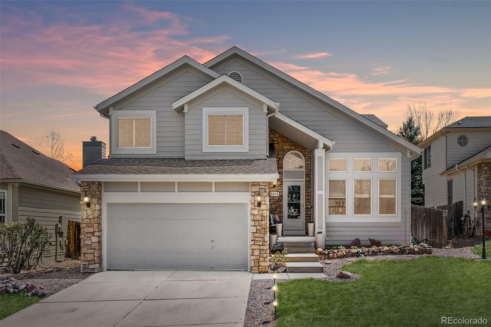 Property Photo: 5474 S Danube Way CO 80015