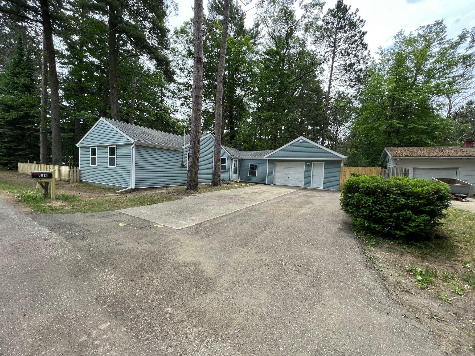 Property Photo:  120 Tamarac Drive  MI 48651 