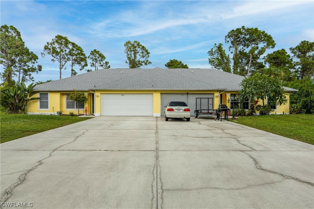 Property Photo:  409-411 Chalet Avenue S  FL 33974 