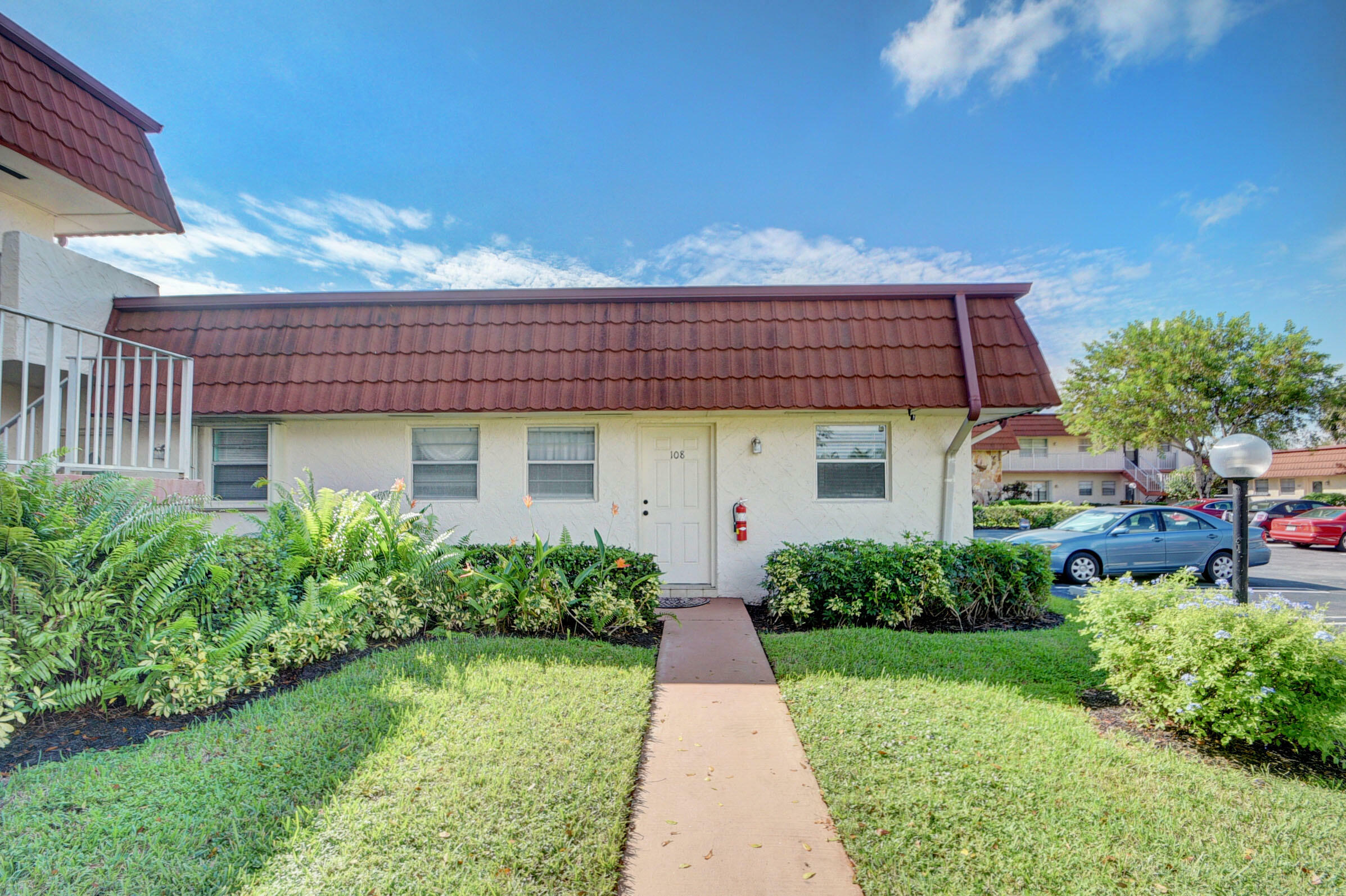 Property Photo:  12007 Poinciana Boulevard 108  FL 33411 