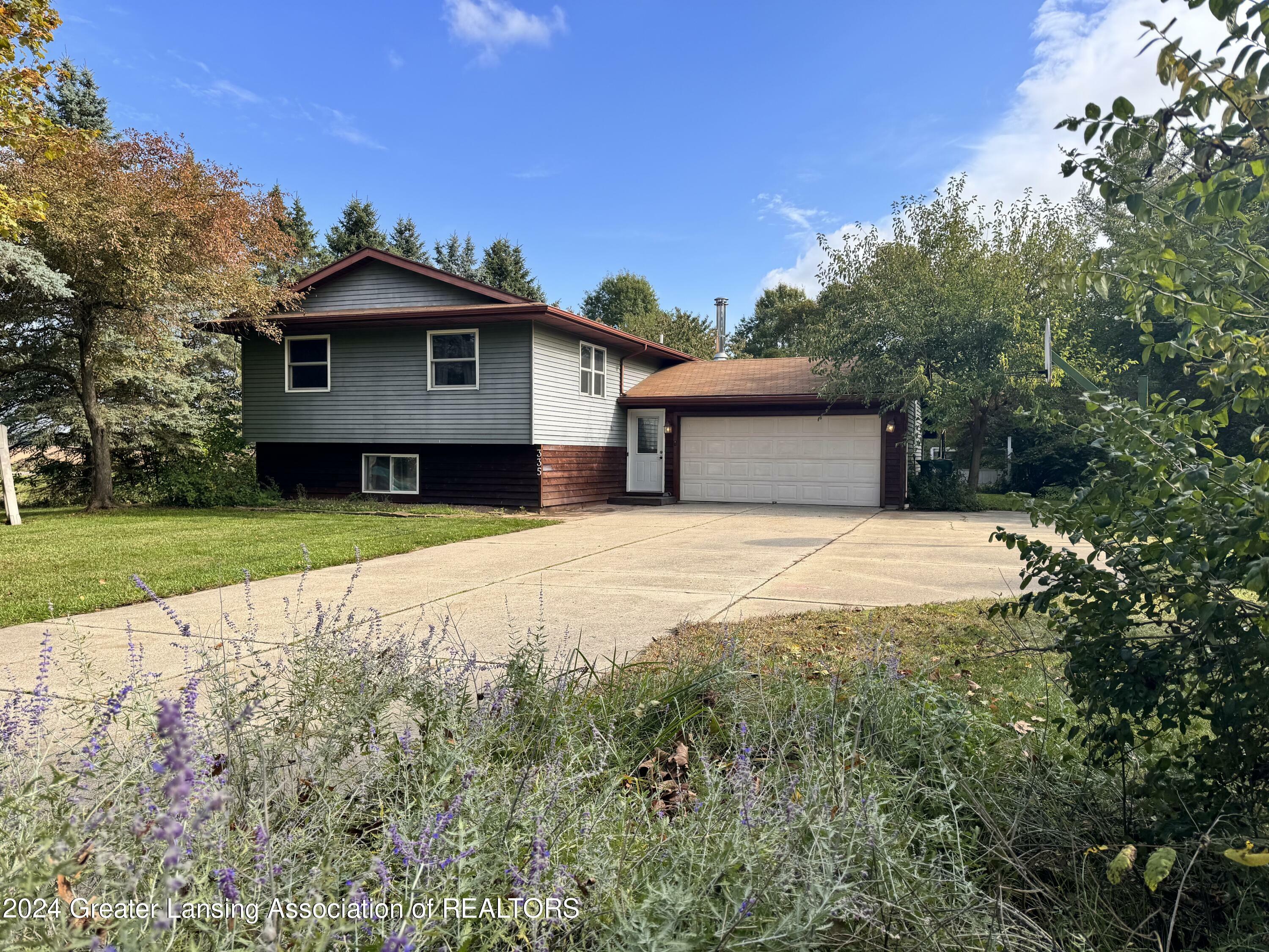 Property Photo:  335 Balsam Drive  MI 48821 