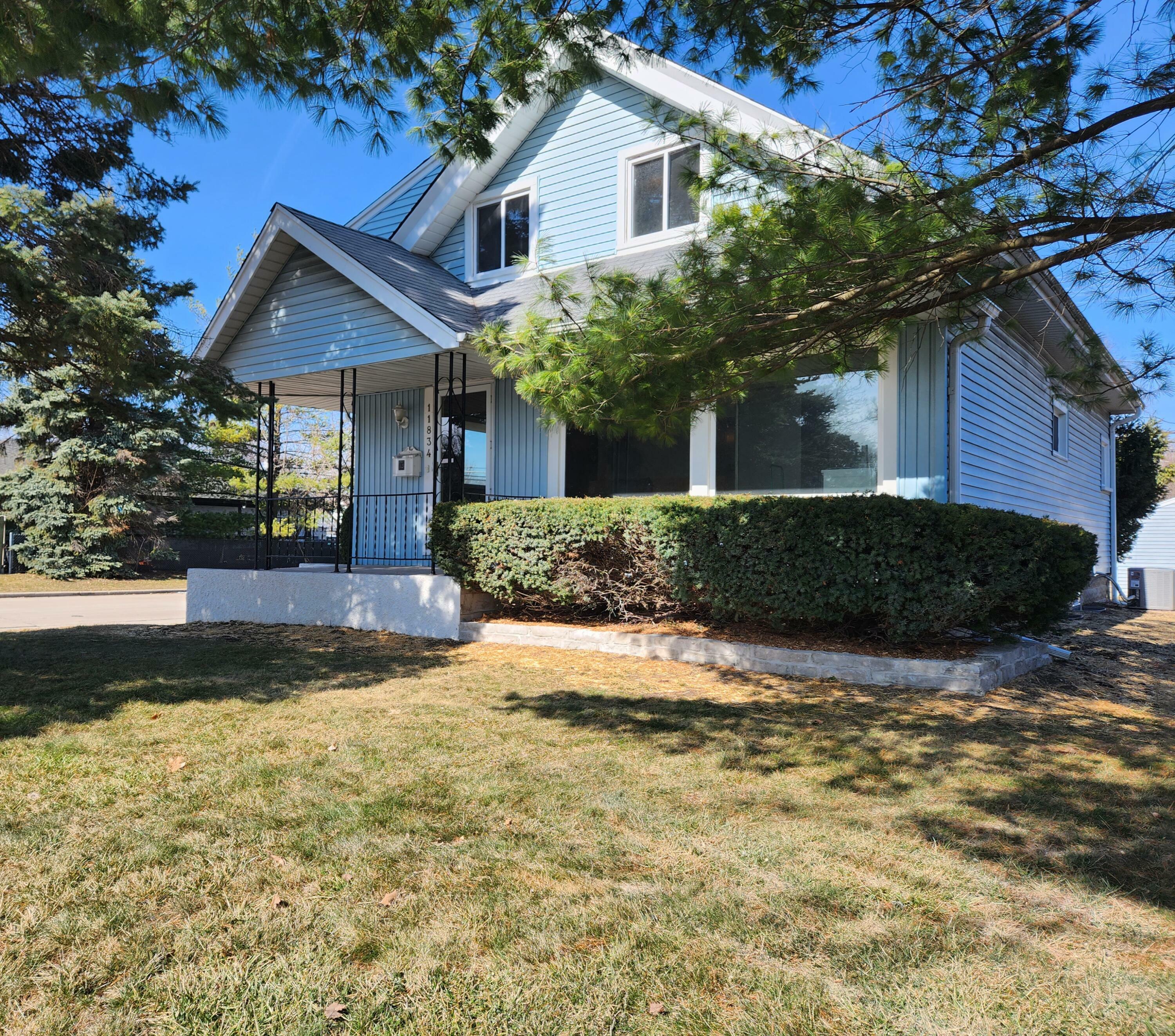 Property Photo:  11834 W Greenfield Ave  WI 53214 
