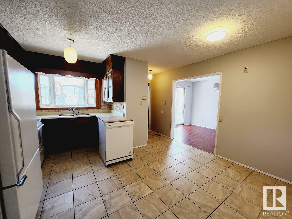 Property Photo:  8725 151 Street NW  AB T5R 1H8 