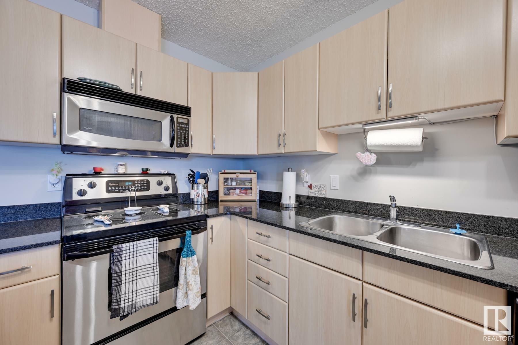 Property Photo:  279 Suder Greens Drive NW 112  AB T5T 6X6 