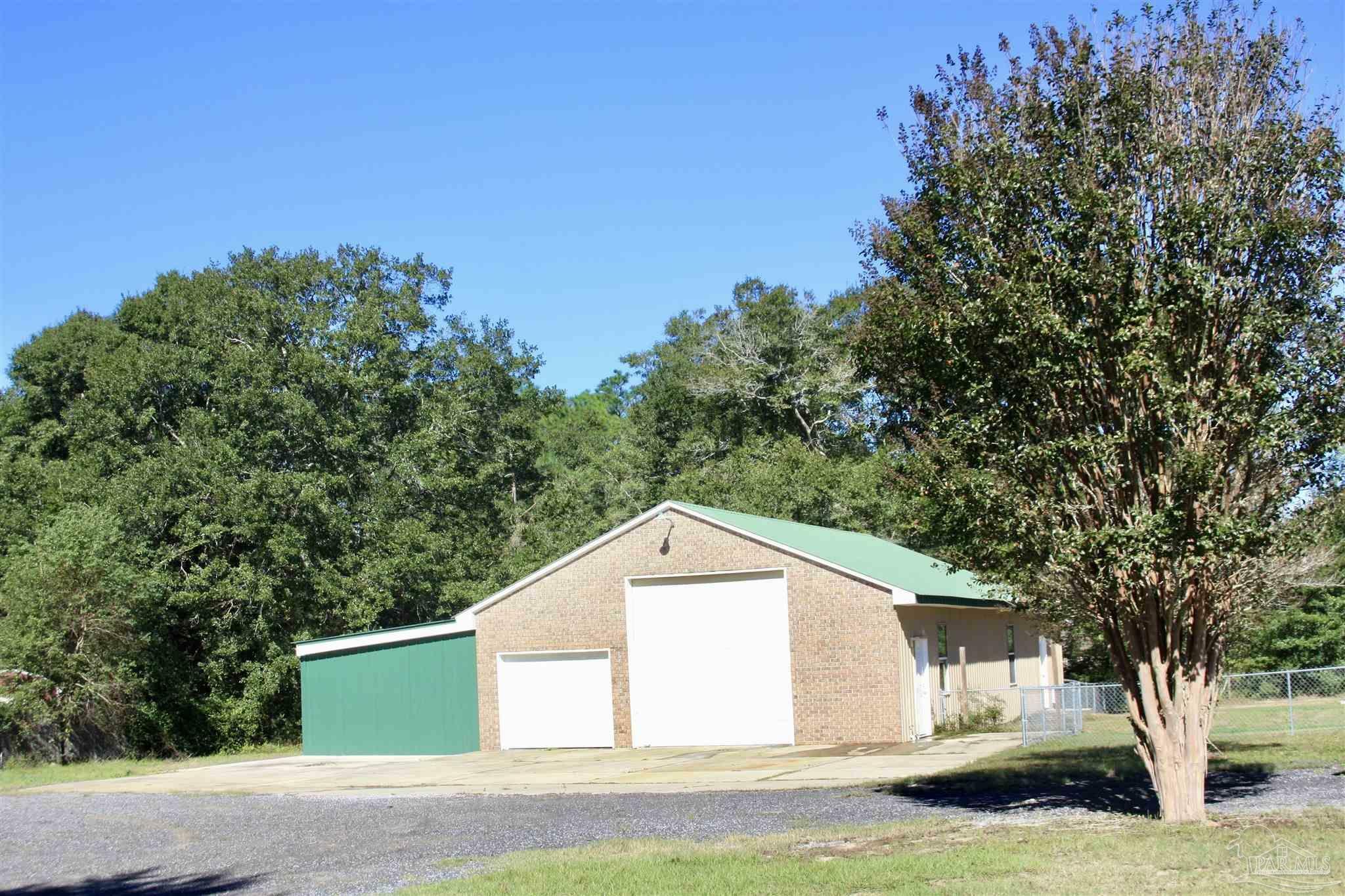 Property Photo:  5628 Pond Creek Rd  FL 32570 