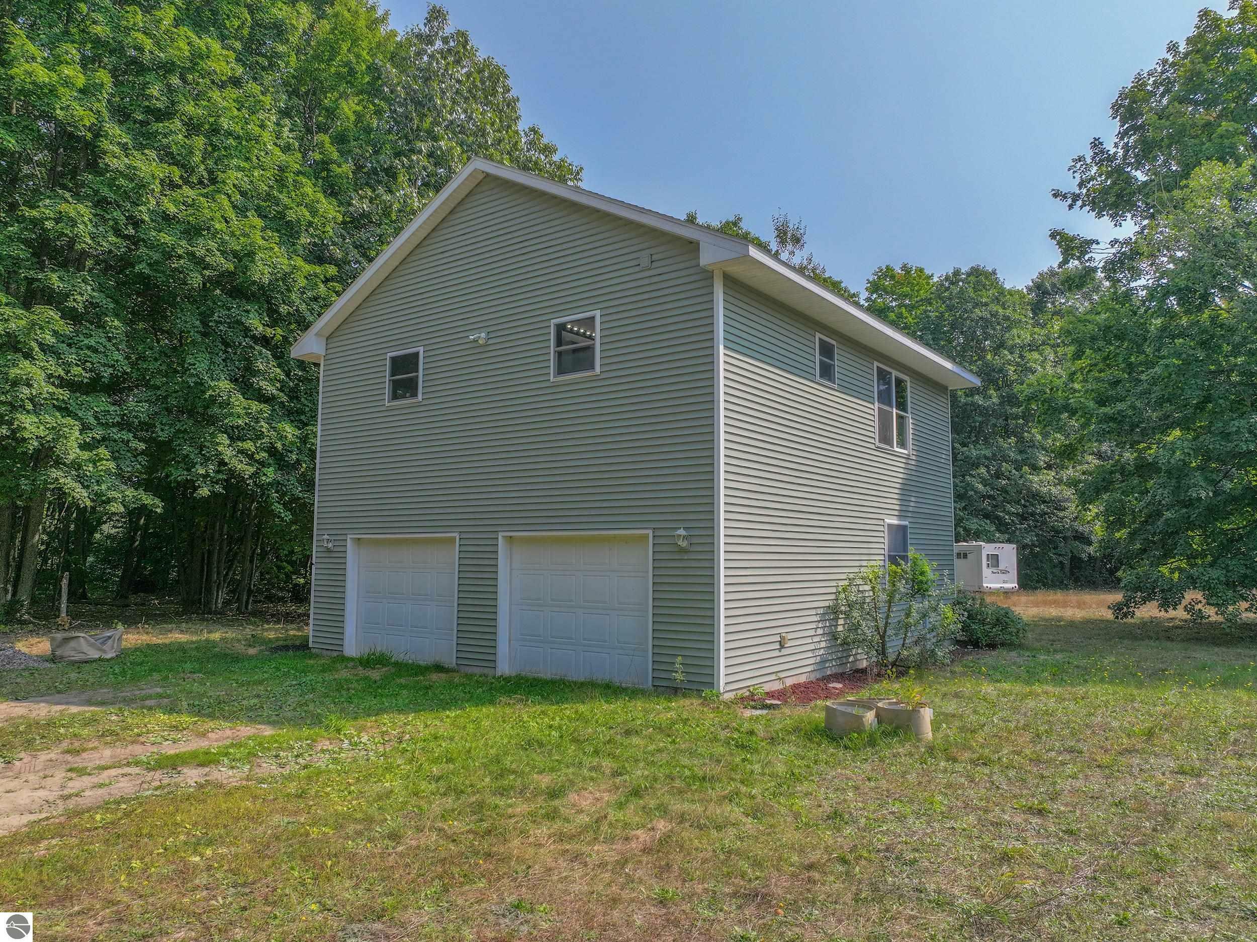 Property Photo:  3444 NE Lost Lake Road  MI 49646 