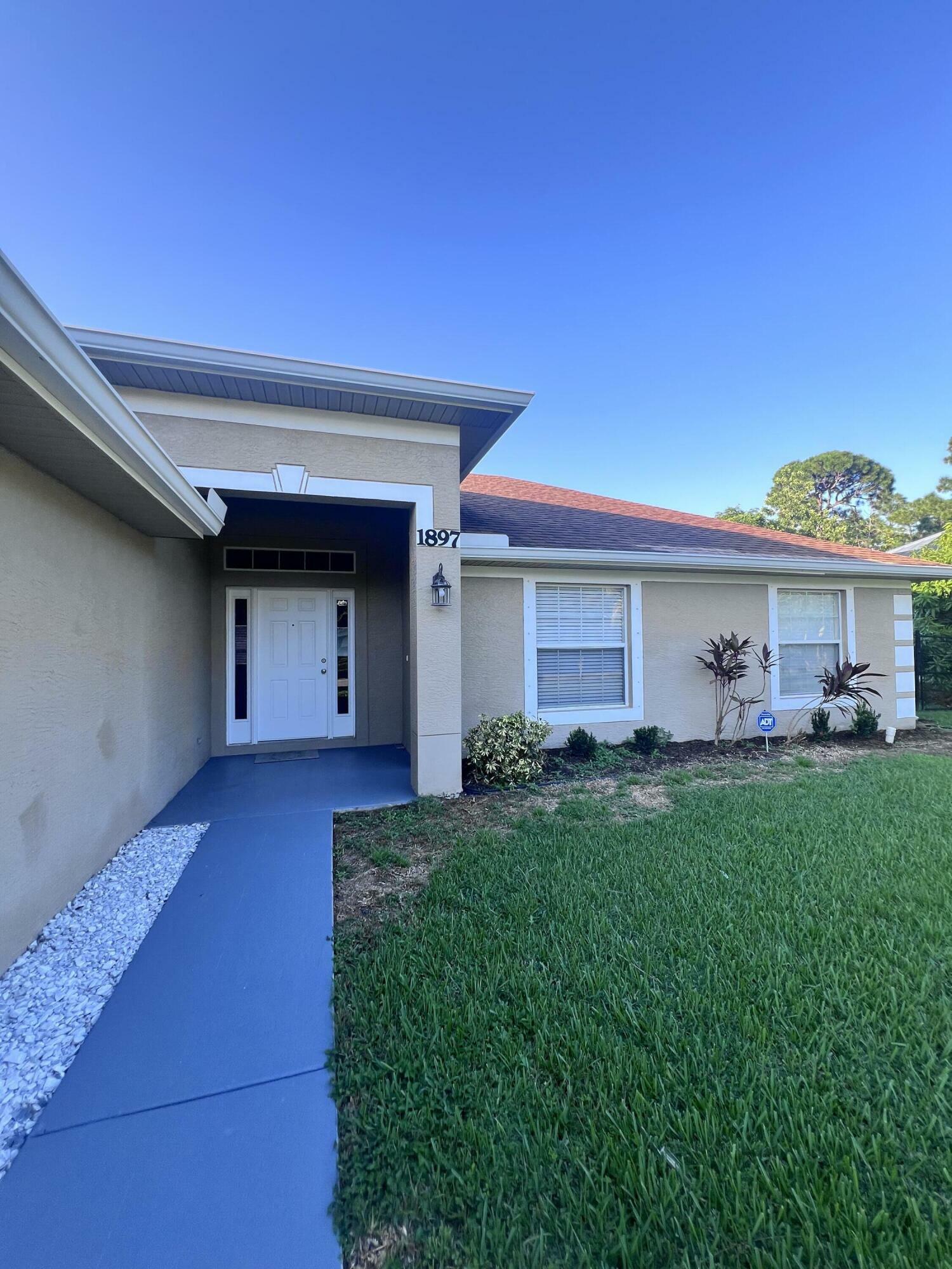 Property Photo:  1897 SW Lofgren Avenue  FL 34953 