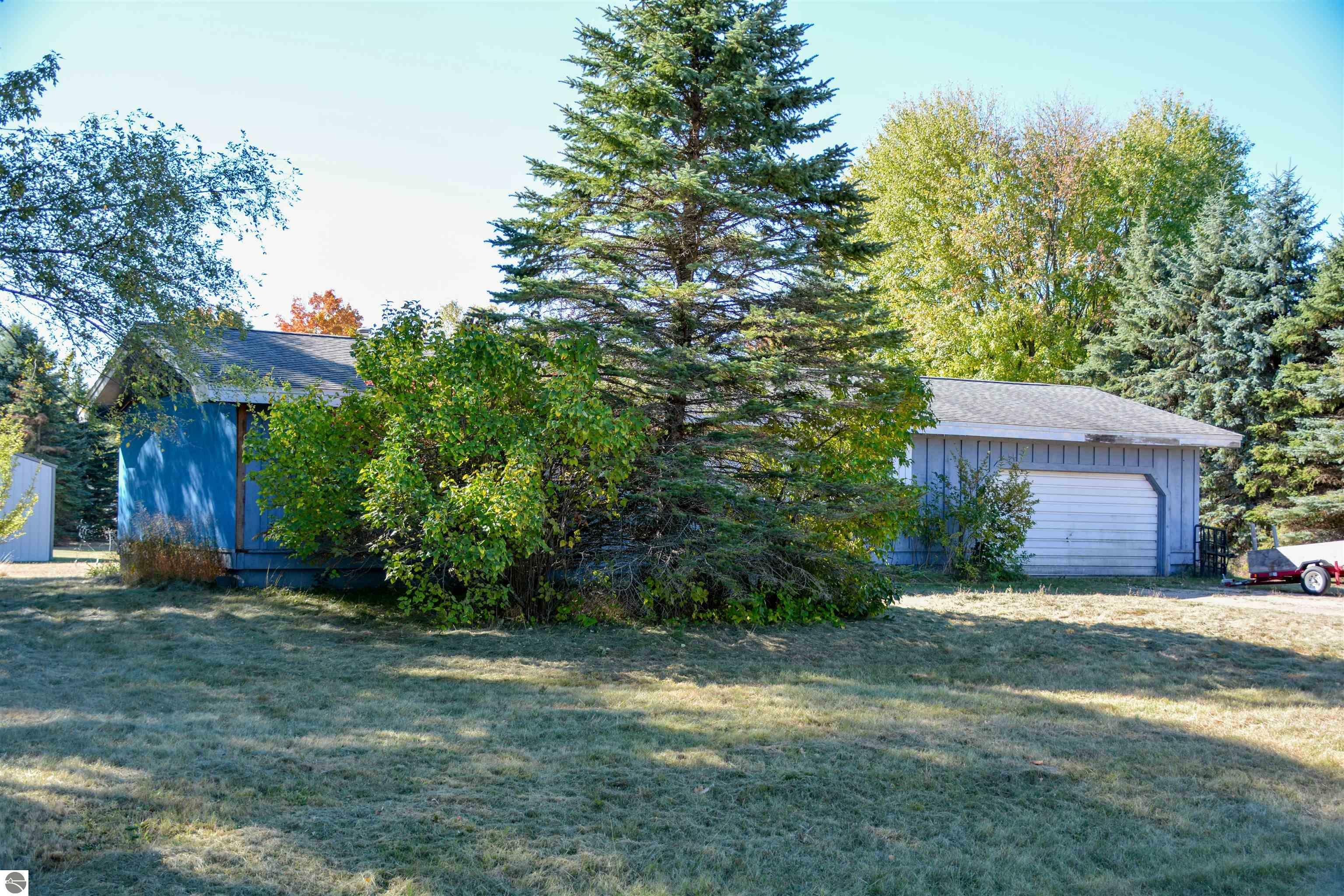 Property Photo:  5461 Sunnyside Street  MI 49637 