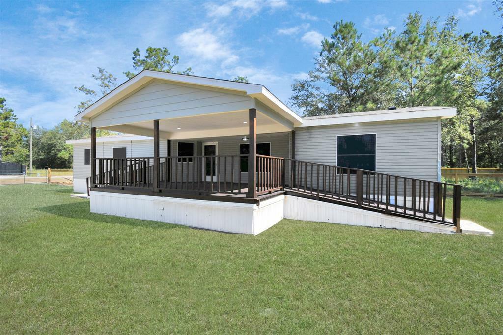 Property Photo:  422 County Road 3414  TX 77327 