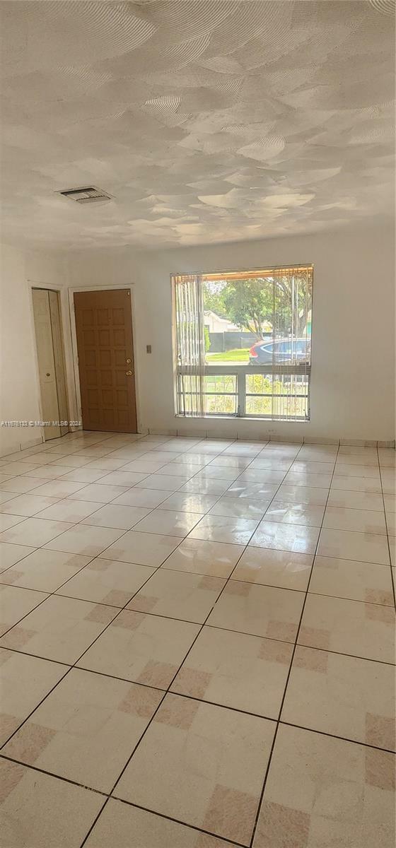 Property Photo:  1055 NW 57th St  FL 33127 