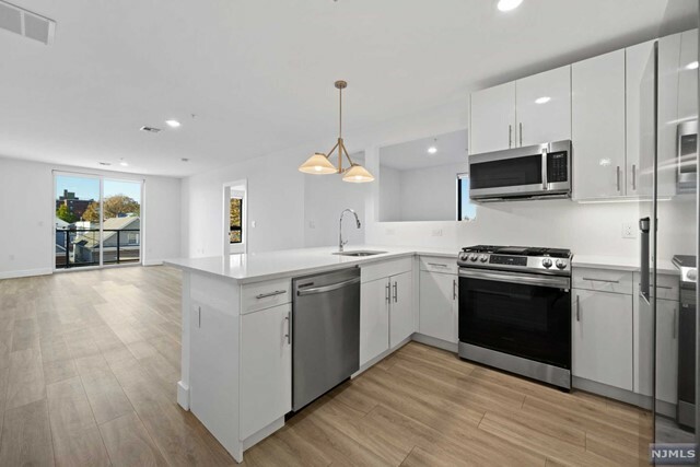 Property Photo:  115-117 W 2nd Street 301  NJ 07002 