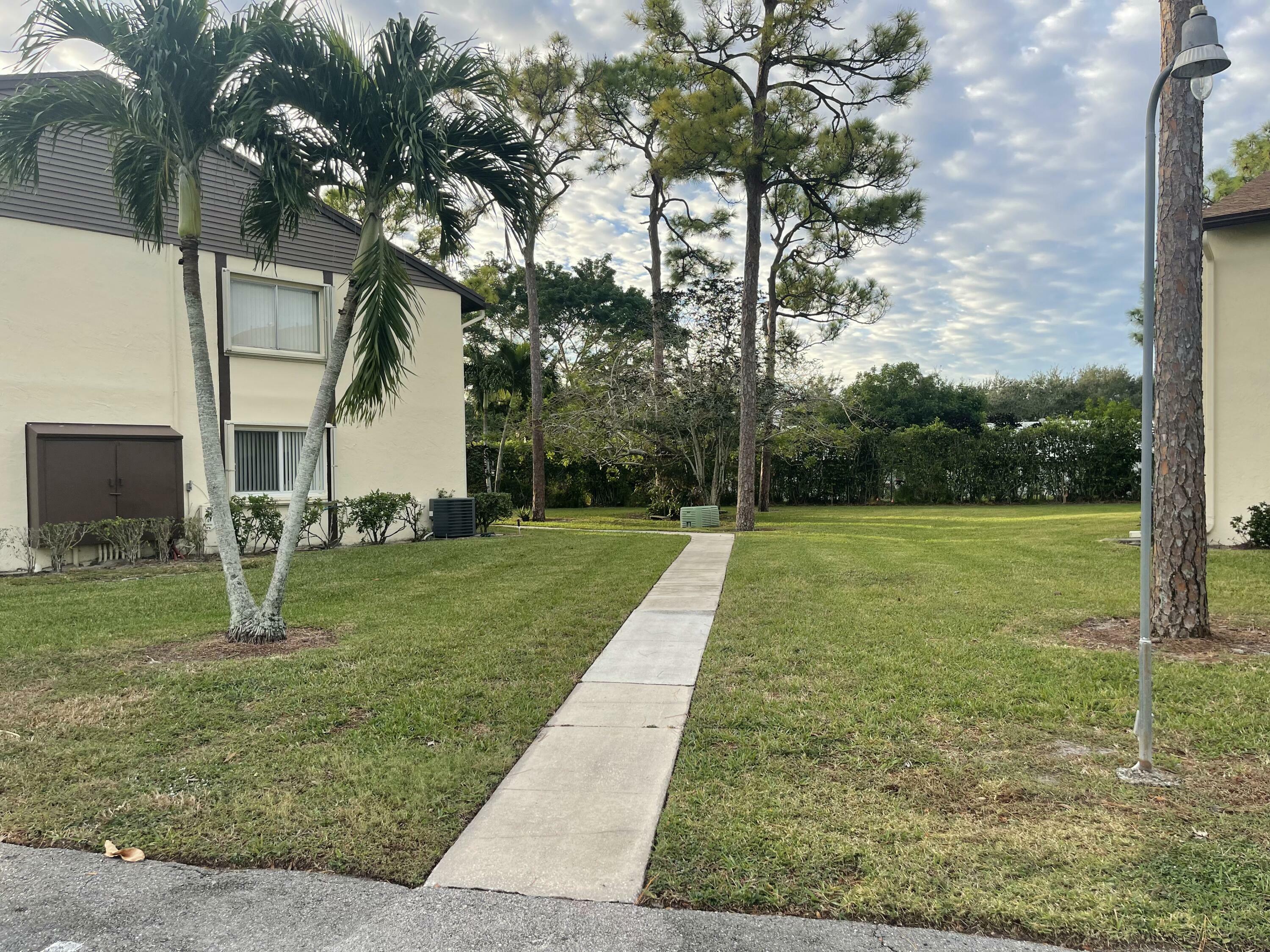 Property Photo:  5830 Whispering Pine B1 Way B-1  FL 33463 