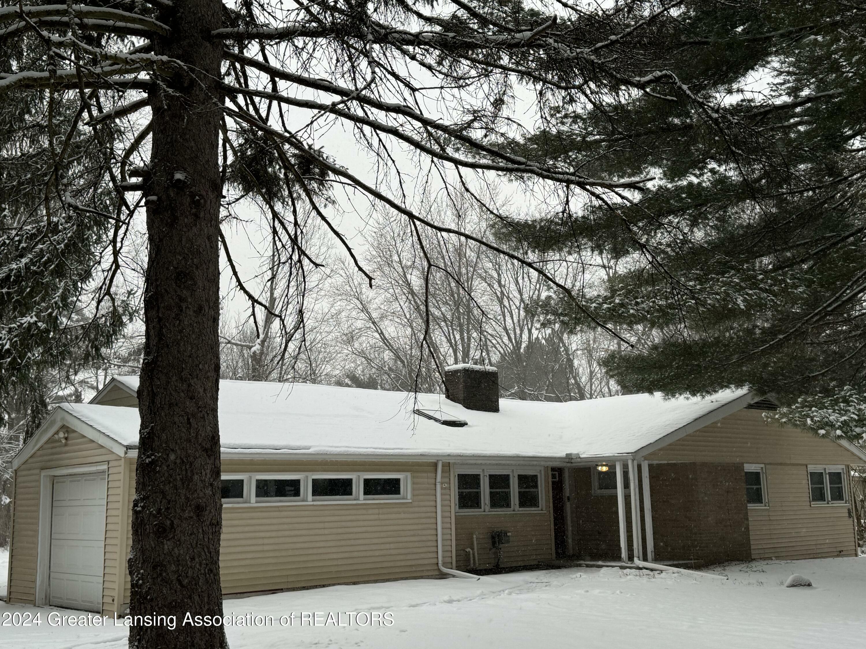 Property Photo:  4589 Van Atta Road  MI 48864 