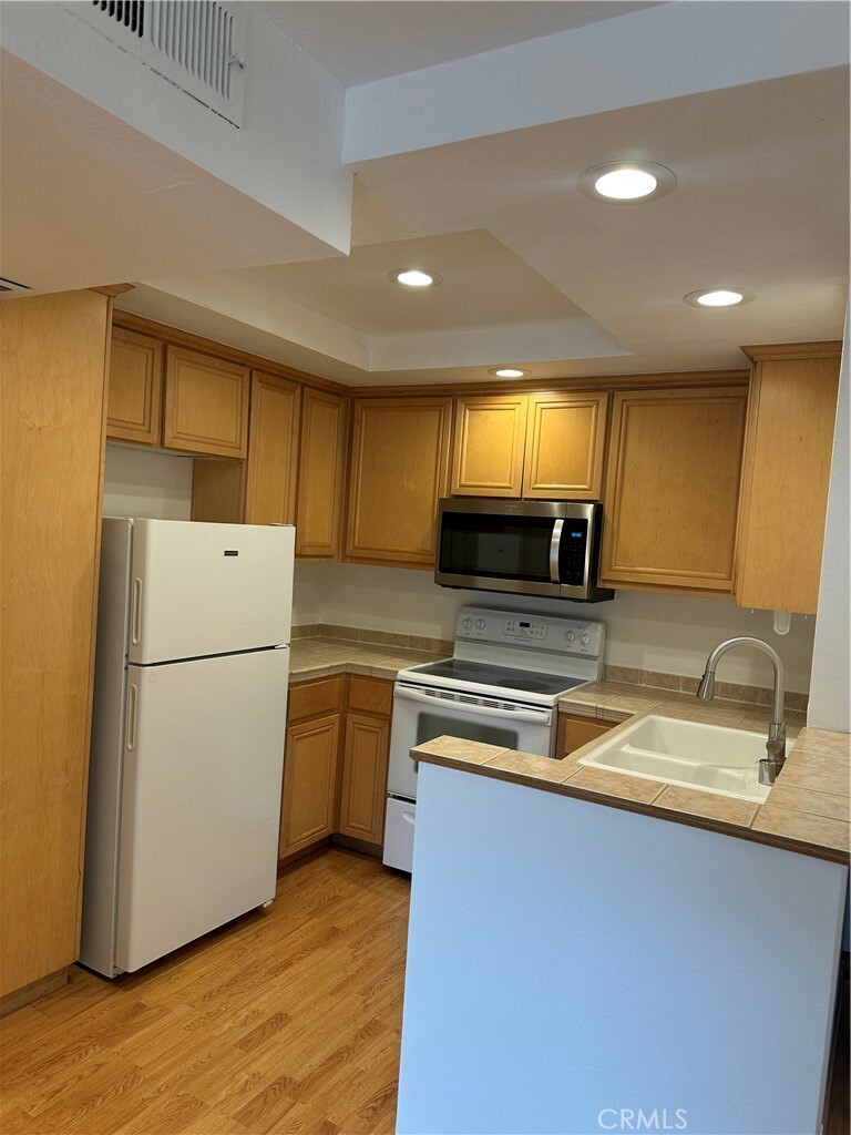 Property Photo:  22100 Burbank Boulevard 324C  CA 91367 