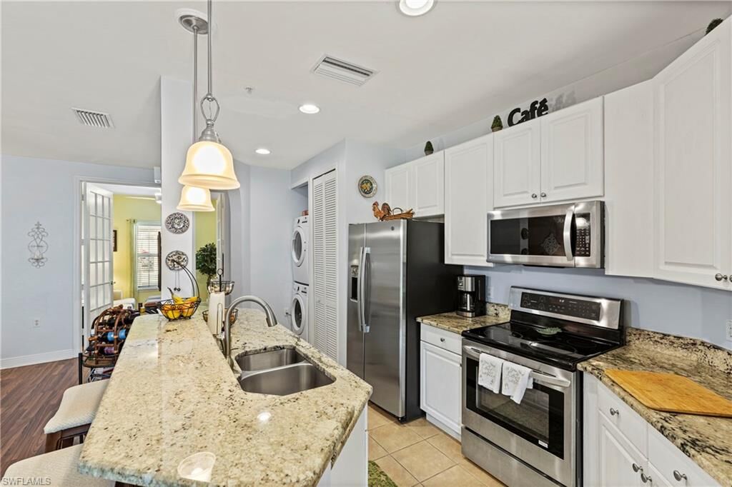 Property Photo:  1330 Sweetwater Cv 102  FL 34110 