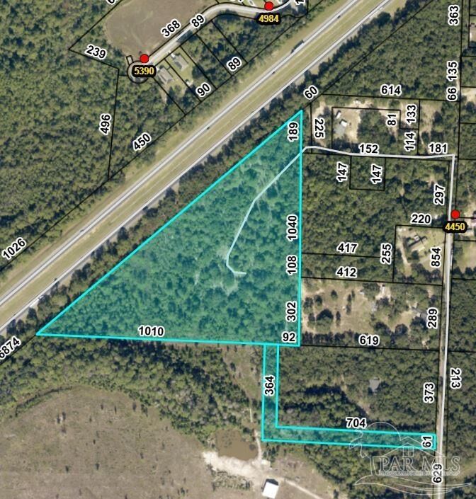 Property Photo: 8097 Woodside Ln FL 32583