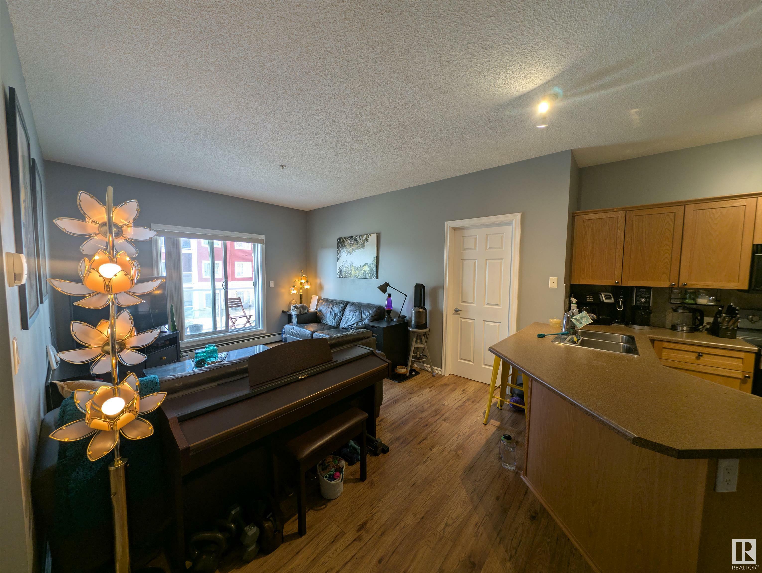 Property Photo: 226 Macewan Road SW 208 AB T6W 0C5