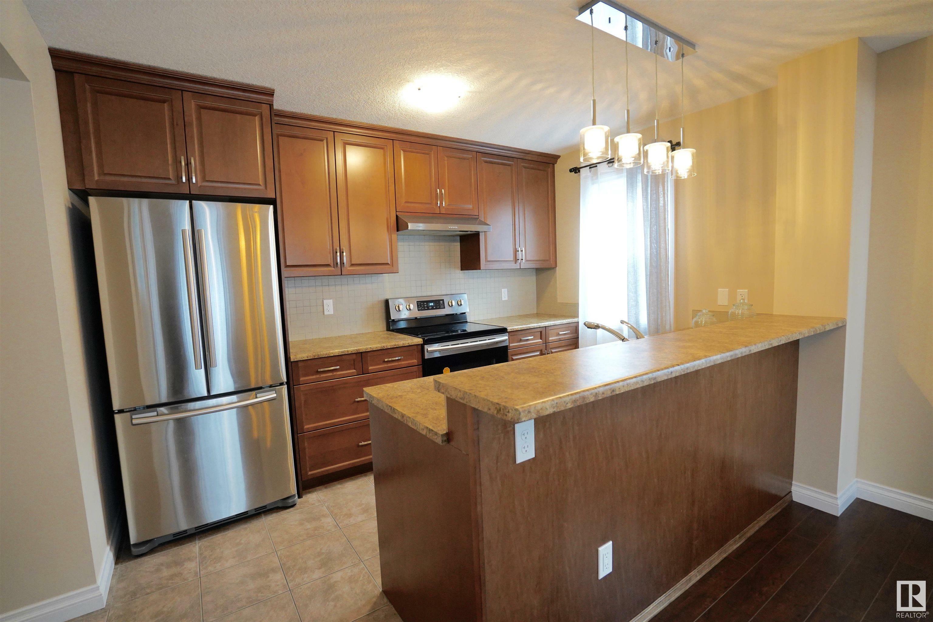 Property Photo: 12018 65 Street NW AB T5W 4L7