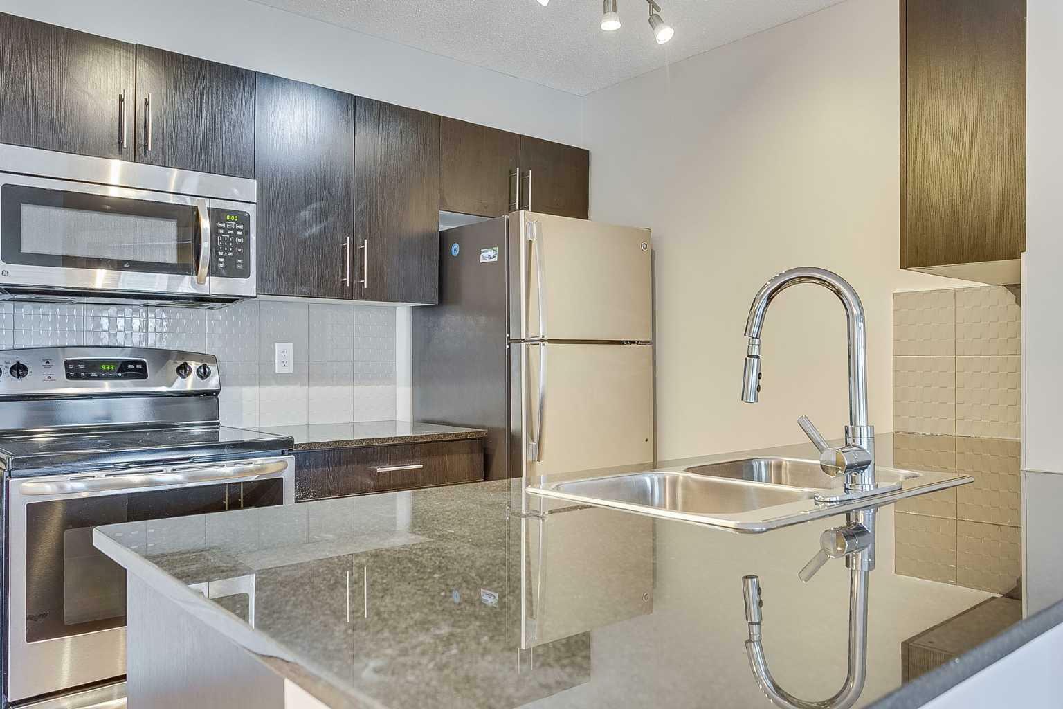 Property Photo:  1317 27 Street SE 4203  AB T2A 4Y5 