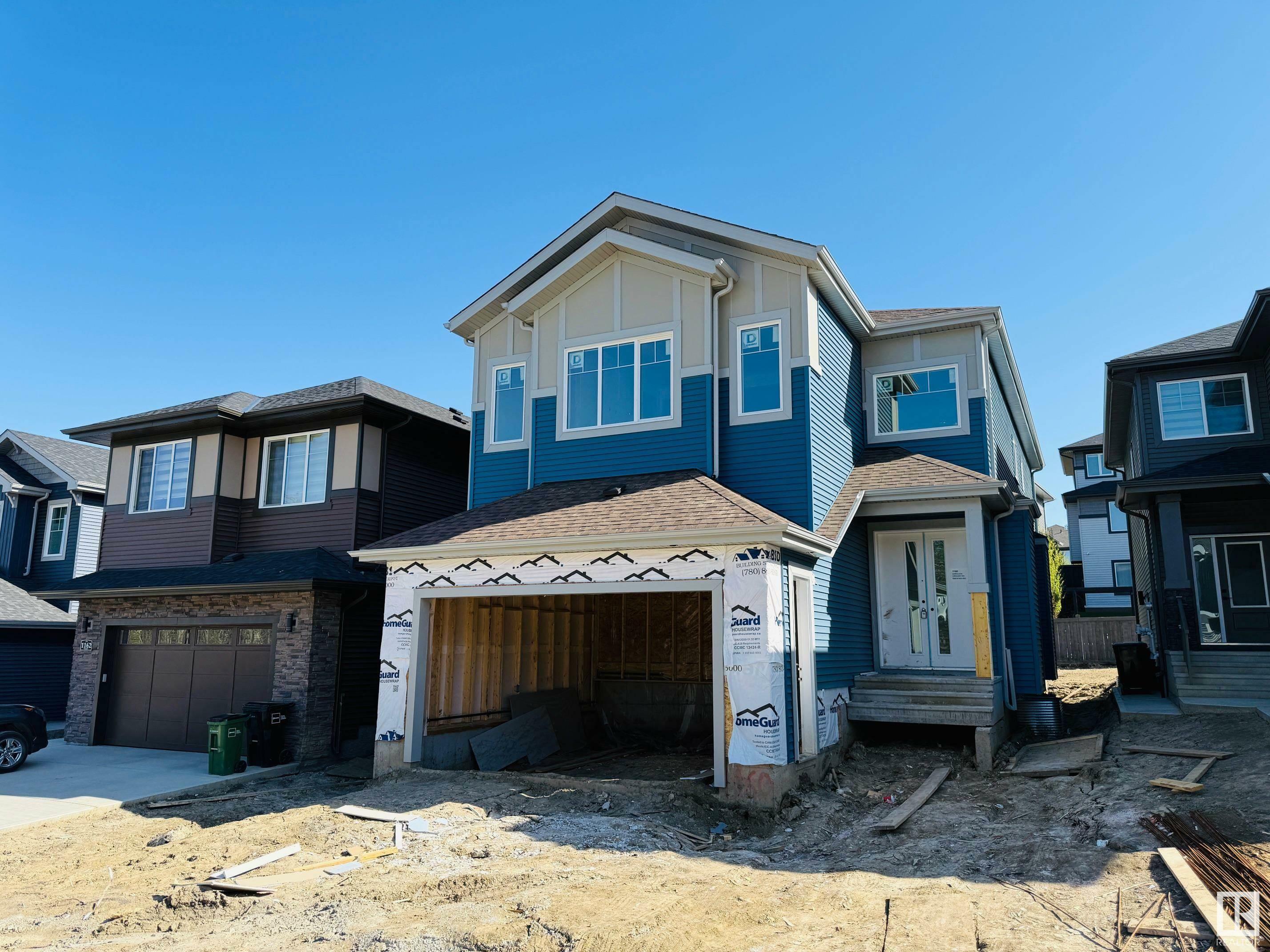 Property Photo: 1160 Gyrfalcon Crescent NW AB T5S 0S1