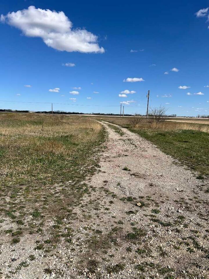 Property Photo: 275115 Glenmore Trail AB T1X 0H4