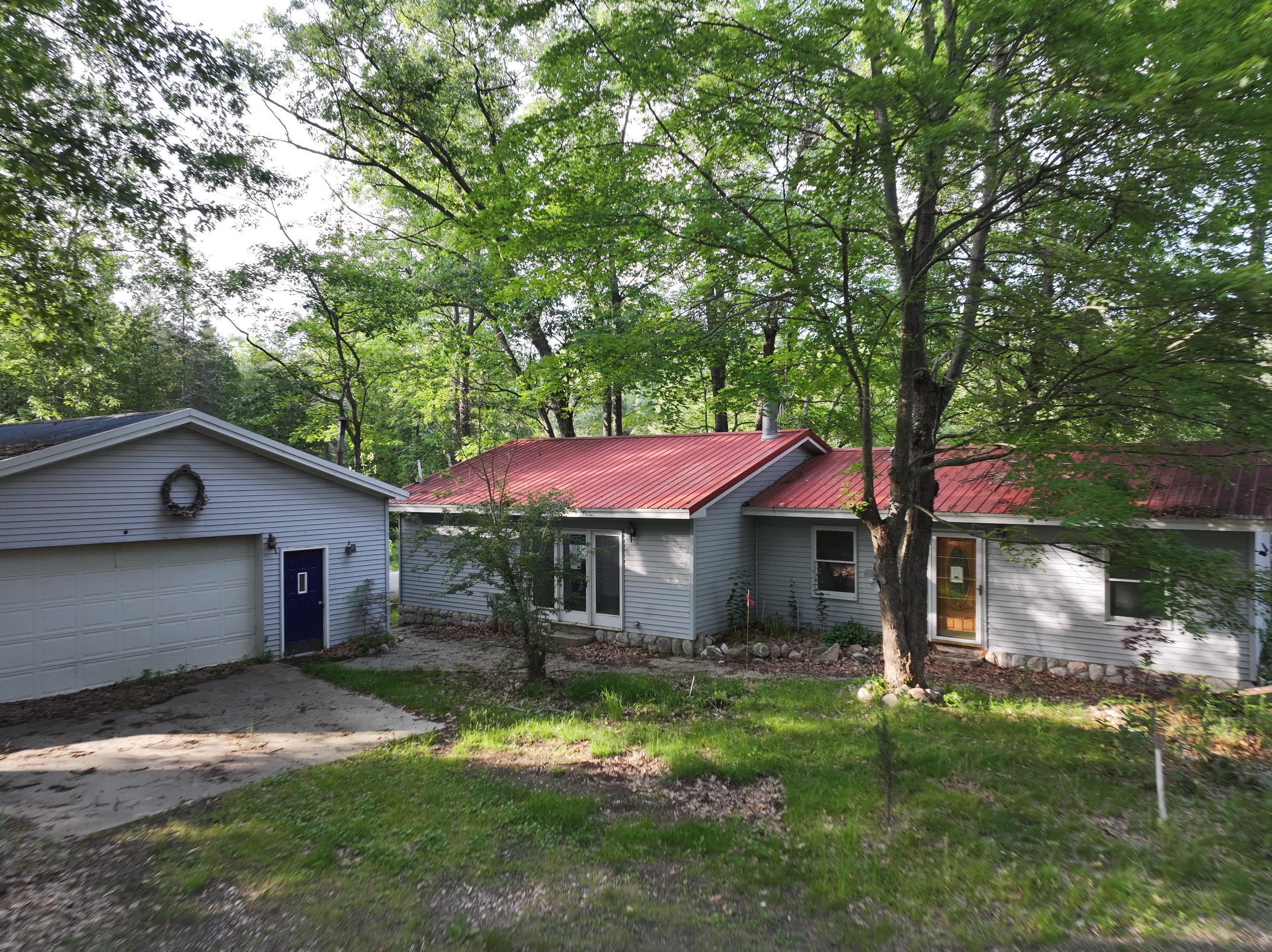 Property Photo: 8750 White Pine Pass SE MI 49633