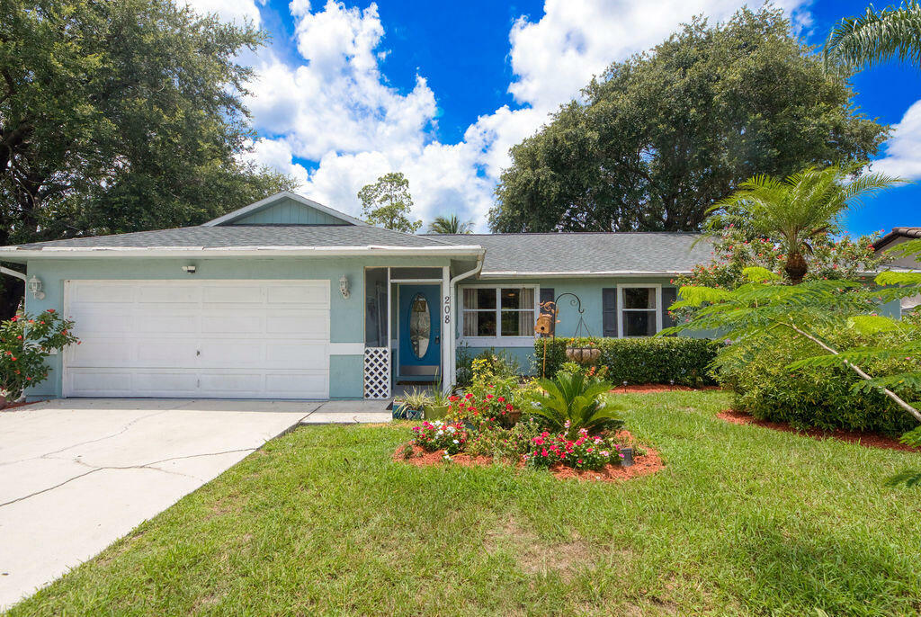 Property Photo:  208 SE Sims Circle  FL 34984 