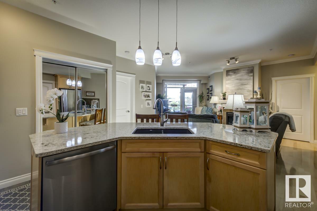 Property Photo: 12408 15 Avenue SW 203 AB T6W 1X2
