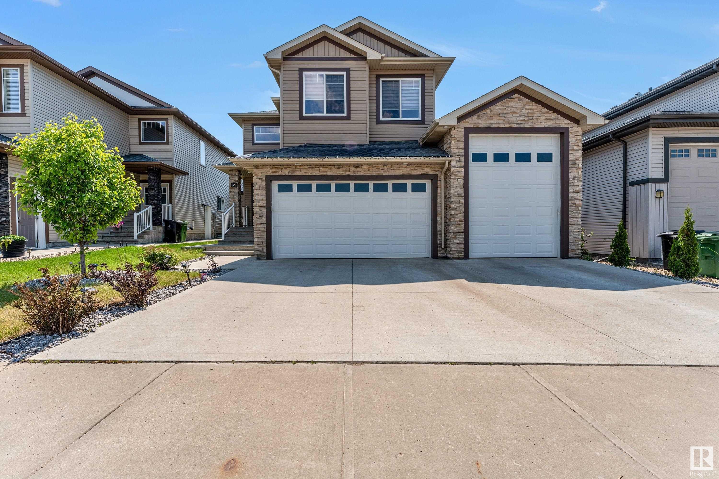 Property Photo: 69 Caragana Way AB T8L 0H4