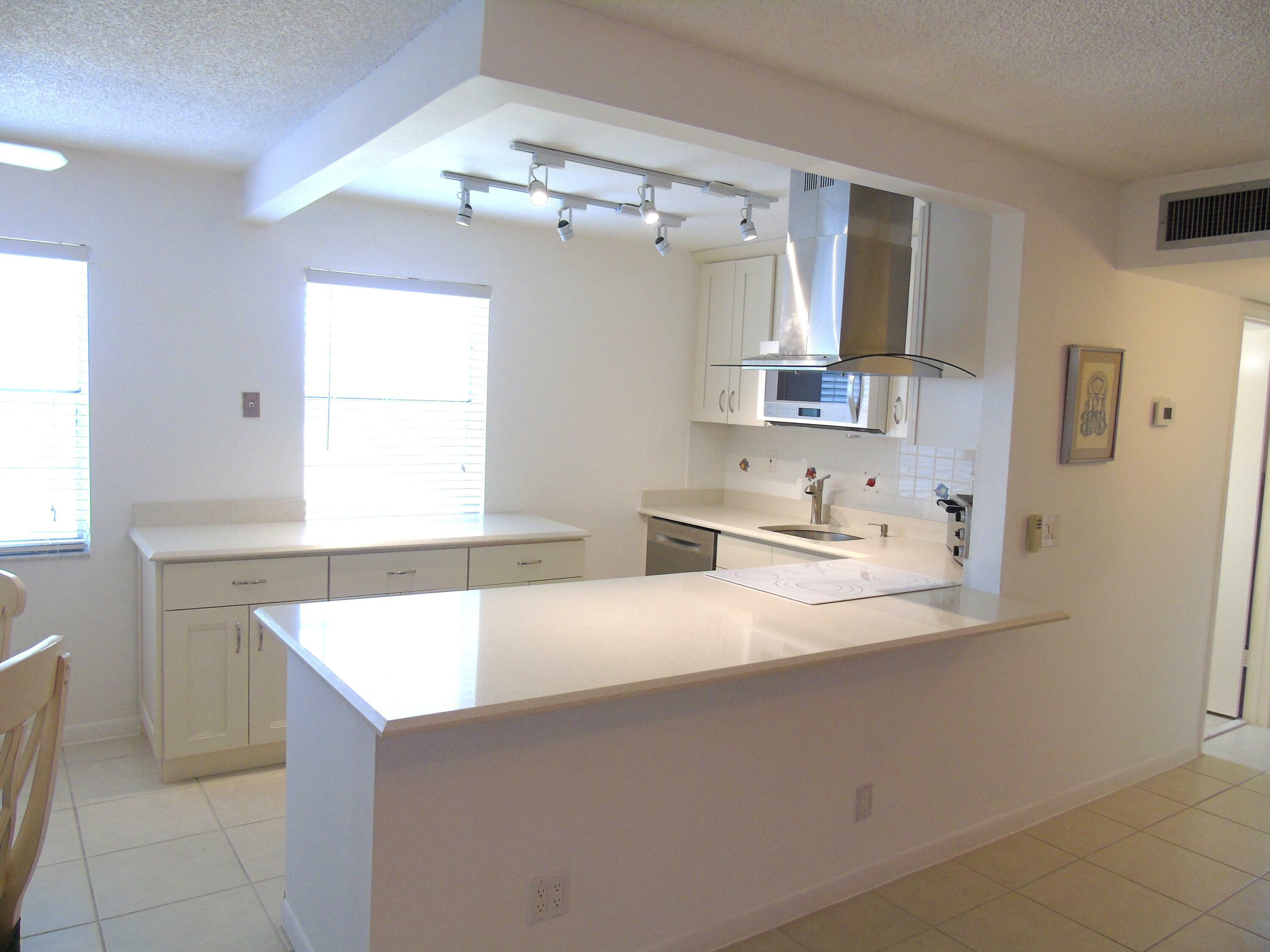 Property Photo:  219 Normandy E  FL 33484 