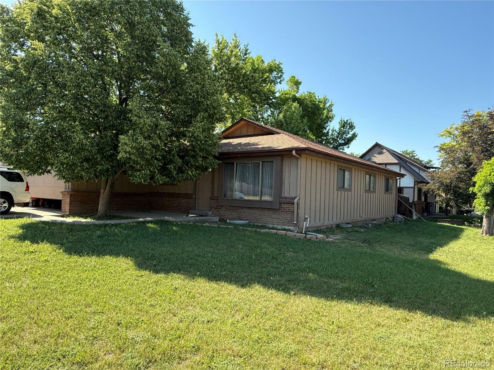 Property Photo: 8995 E Cornell Avenue CO 80231