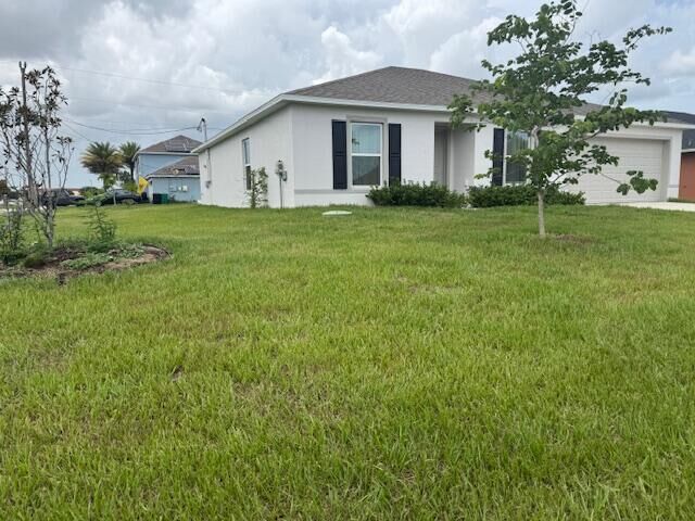 Property Photo: 591 SW Halifax Avenue FL 34953