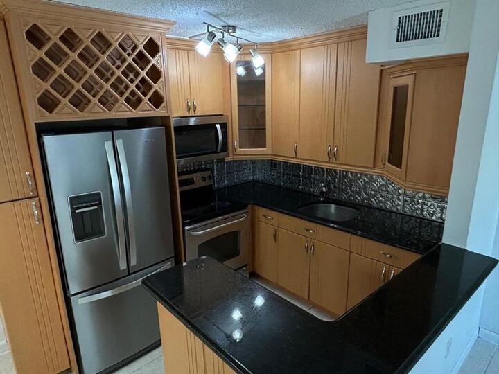 Property Photo:  485 NW 210th St 104  FL 33169 