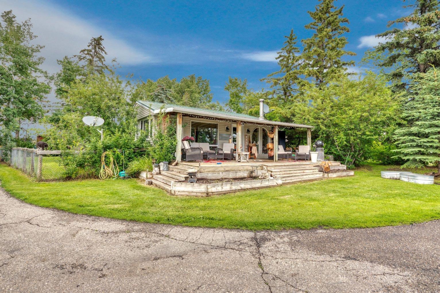 Property Photo: 338067 1067 Drive E 10 AB T1S 4T2