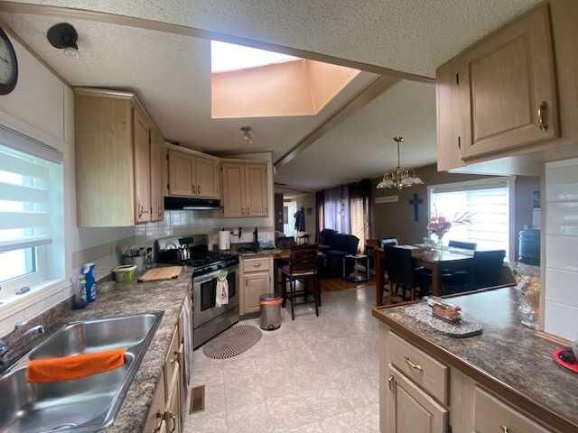 Property Photo:  30 Lake Stafford Crescent E  AB T1R 0P5