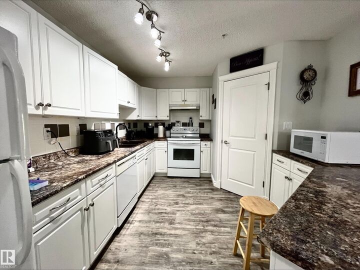 Property Photo:  6 Spruce Ridge Drive 204B  AB T7X 4P4 