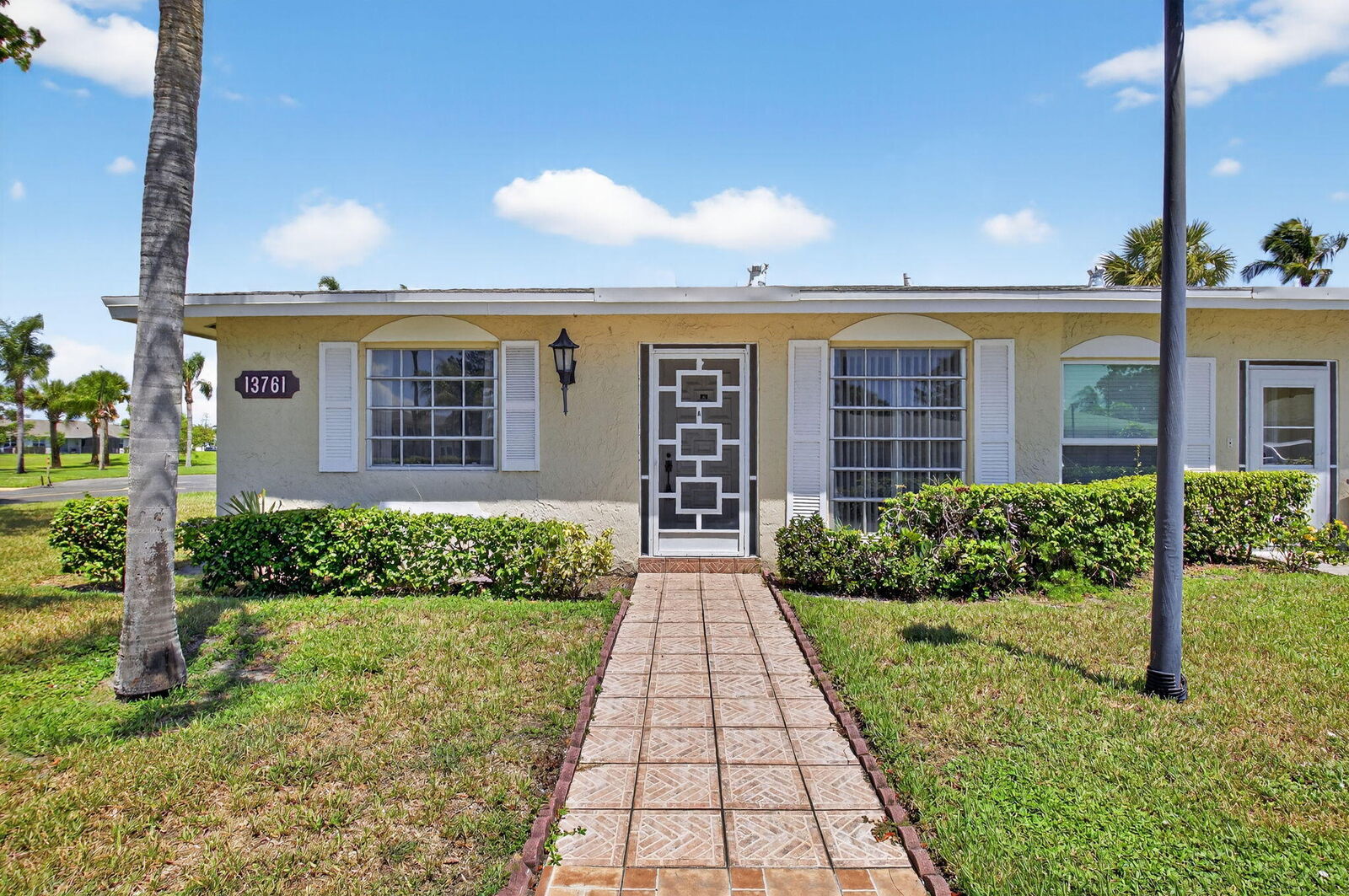 Property Photo:  13761 Flora Place A  FL 33484 