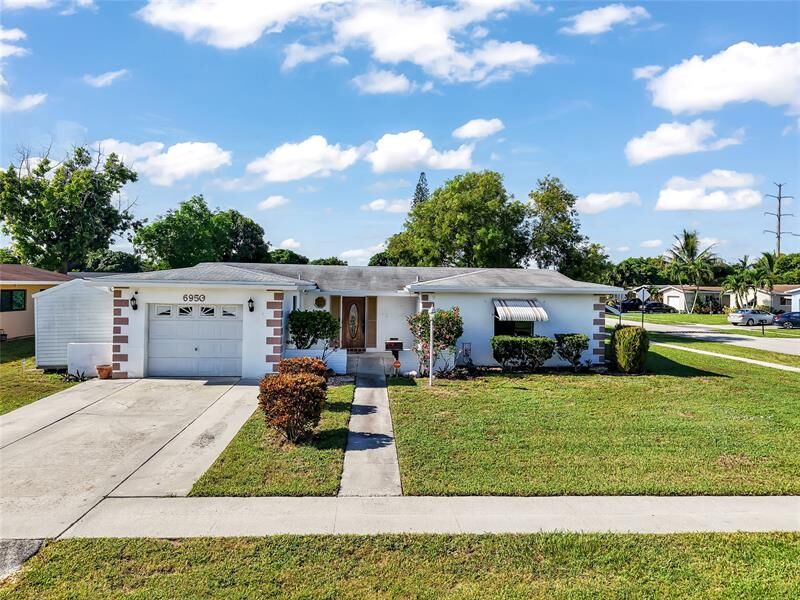 Property Photo:  6950 SW 9th Pl  FL 33068